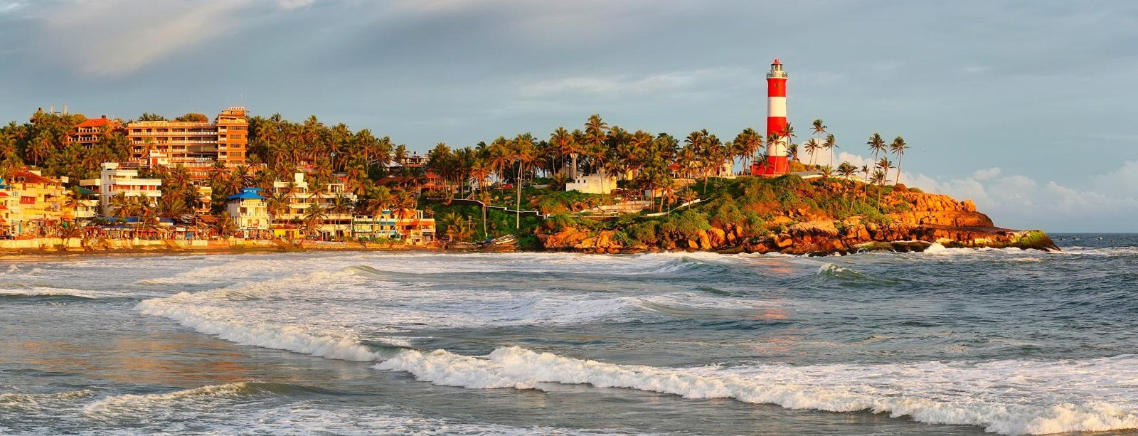 Kovalam’s lighthouse above the curve of the coastline