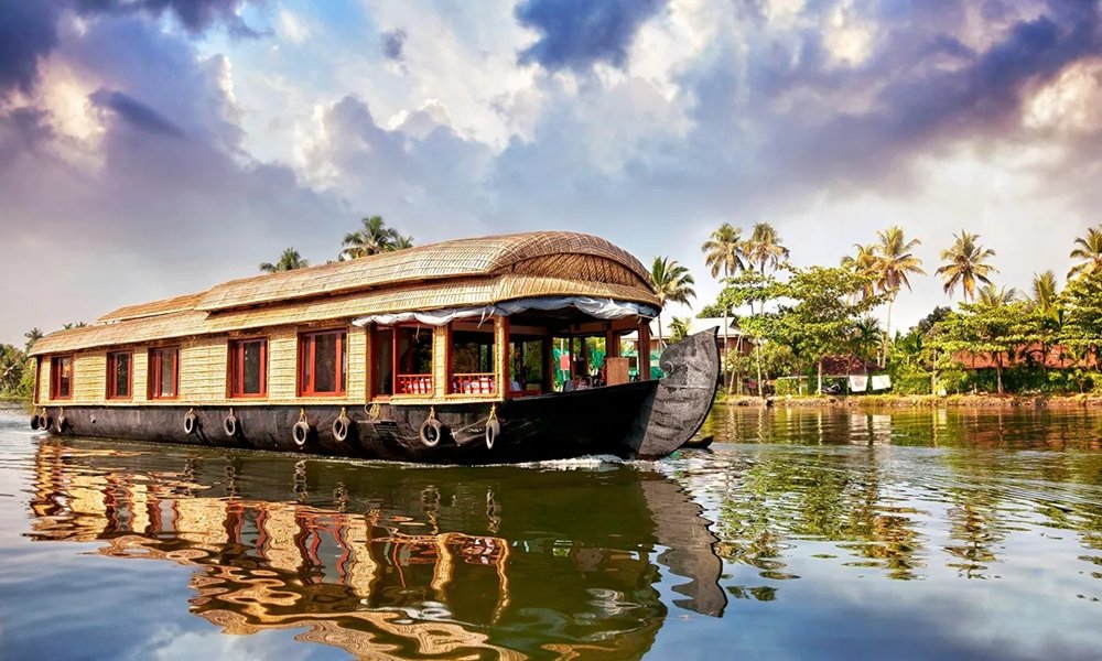 Traditional houseboat on a palm-lined canal