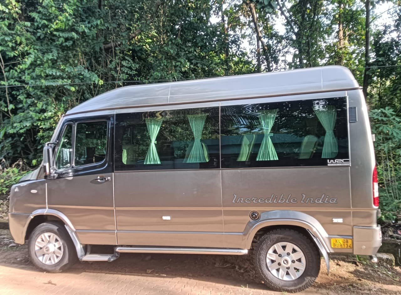 Silver touring minibus with large side windows