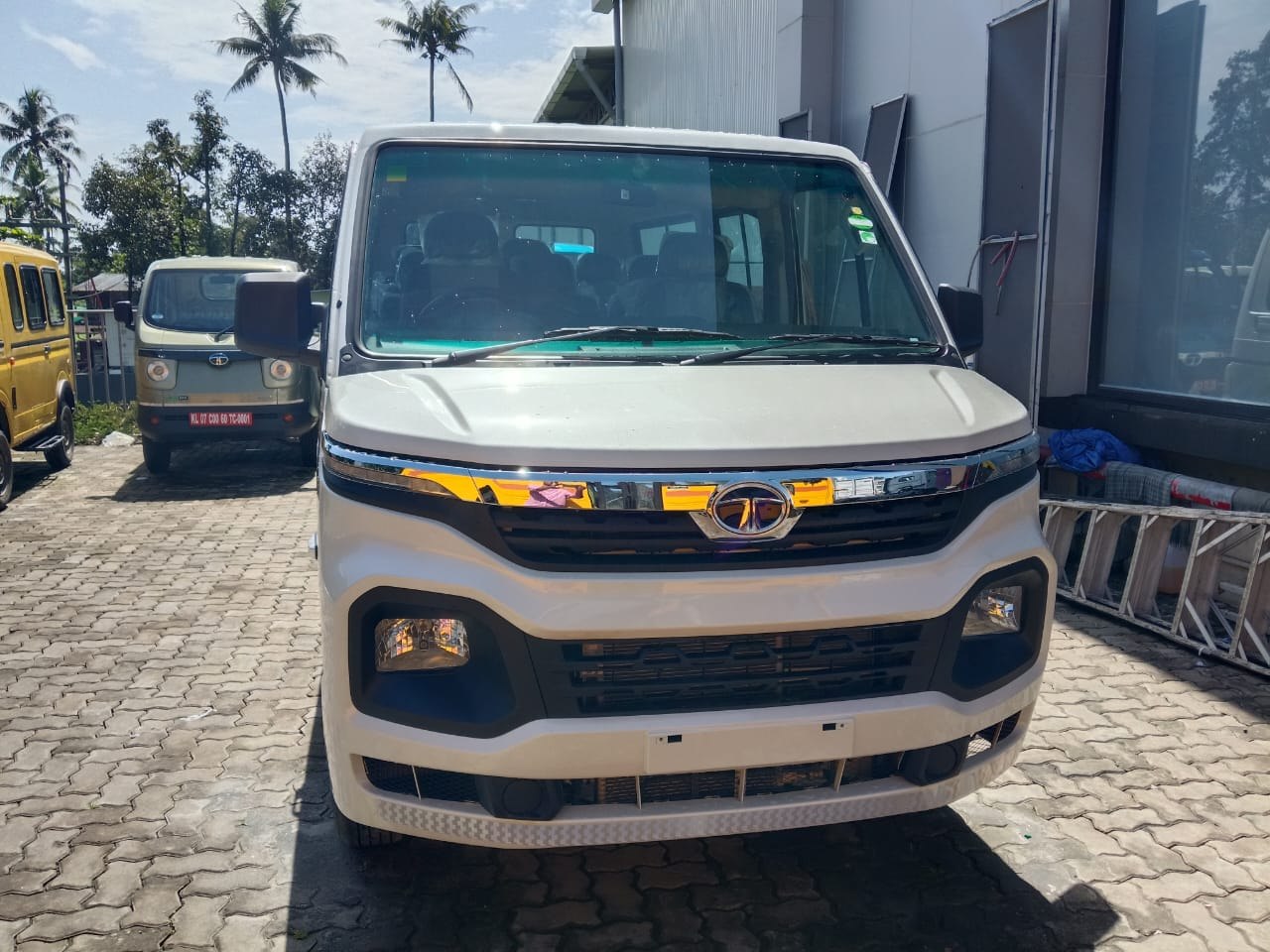 Front view of the white Tata passenger van