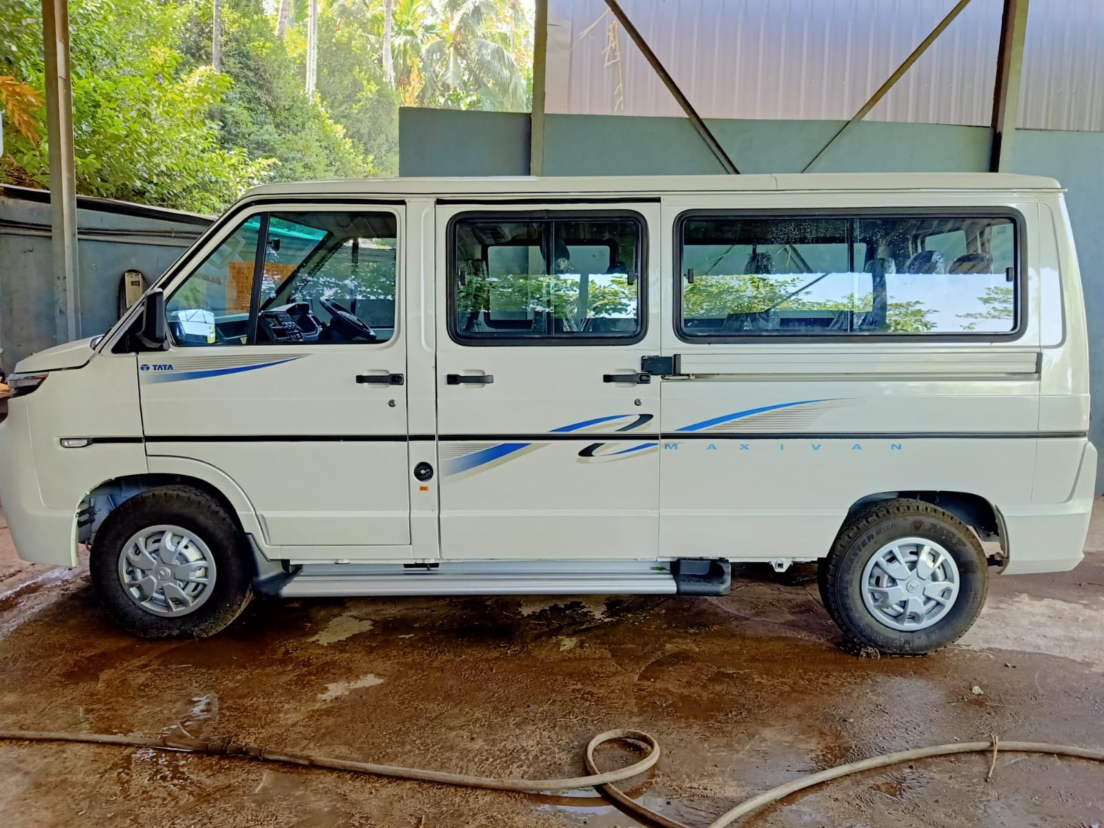 Side view showing the passenger van’s windows and cabin